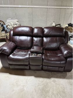 Leather power reclining sofa