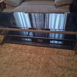 GLASS TV STAND CONSOLE...WITH SHELFS..NICE. NICE..60 X20 H X 18 DEEP ...