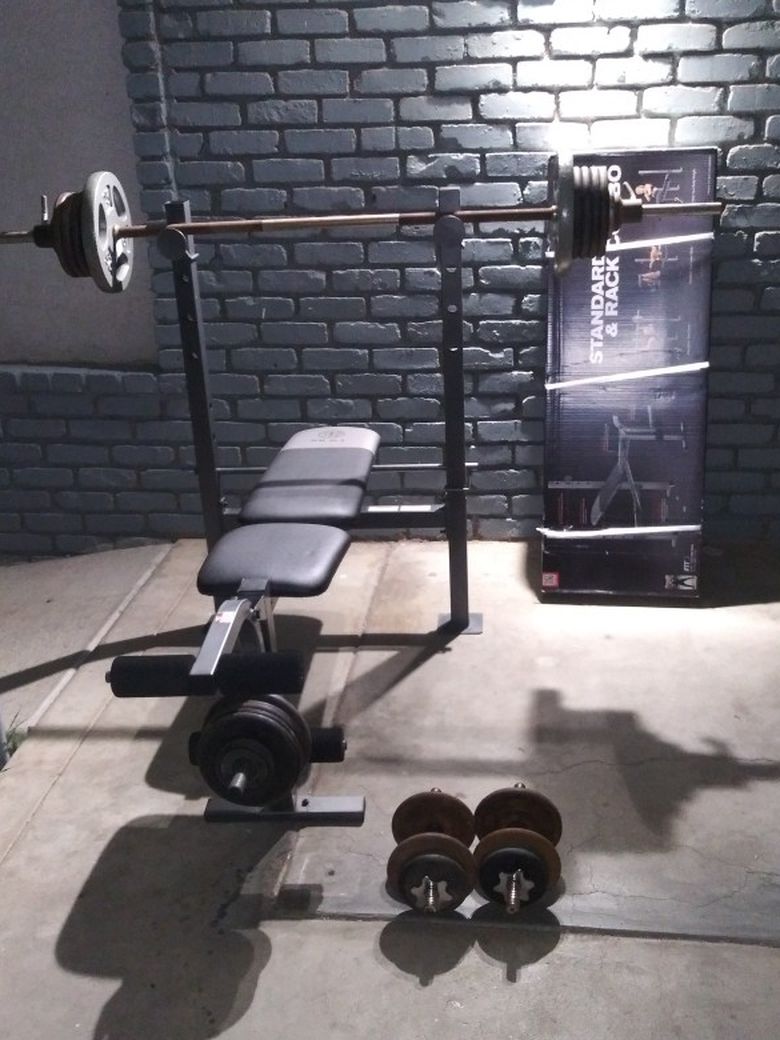 Bench, Straight Bar, 2 Dumbells, 6 Collars And 230lbs Of Weight