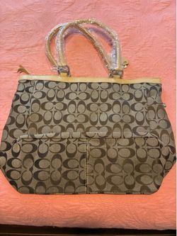 This is a Coach signature monogram "Bubble Fish" appliqué carryall bag, likely from the 2005 collection.