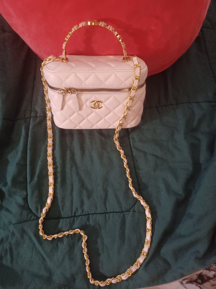 👜