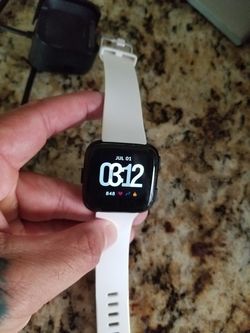 Fitbit versa, with charger