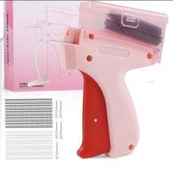 Tagging gun for clothes new in box Pink/red Comes With Storage Box On Top 