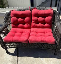 Outdoor Wicker Loveseat with Red Cushions