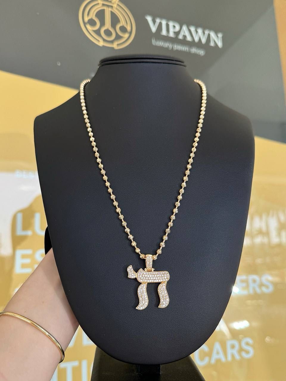 14k yellow gold diamond Chai pendant and 18k yellow gold half of moon chain 22”