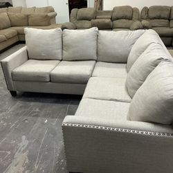 Light grey small sectional couch