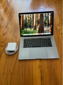 15 inches Macbook Pro 2018 TouchBar Laptop macOS Sequoia i7 6-Cores @2.6Ghz RAM 16Gb SSD 512Gb Dual GPU Radeon Pro Microsoft Office Final Cut Logic Pr