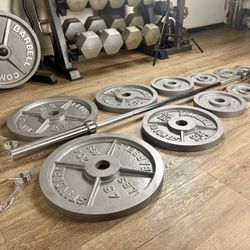 Full set of CAP Gray Olympic Weight Plates in NEW Condition & Brand NEW 6 ft Bar Steel Bar With Cooper Bearings [ Total 287 lbs]. 