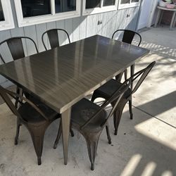 Gray metal Table And Chairs (W32” X L60” X H30”)