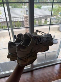 New Balance 9060s in a beige/cream colorway