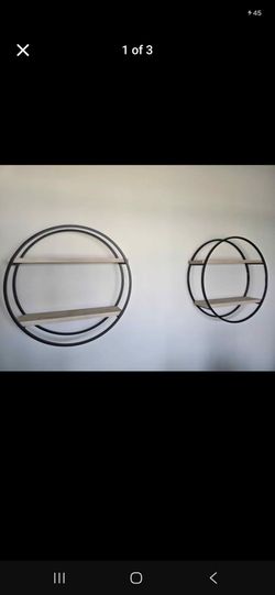 Kirkland like new , daimeter 28inch

Set of 2 Circular Metal and Wood Wall Shelves