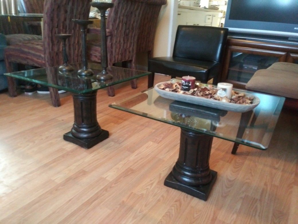 Nice 2 end tables, the glasse's is heavy's and black columns
