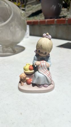 This image shows a vintage 1979 Precious Moments "Mother Sew Dear" figurine