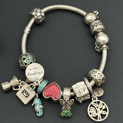 Jewelry Pandora 925 sterling silver gold tone 6.75” charm bracelet with 10 charms