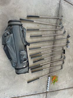 Vintage Assorted golf clubs with bag