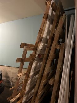 Longer Wooden Pallets in good shape, being stored inside