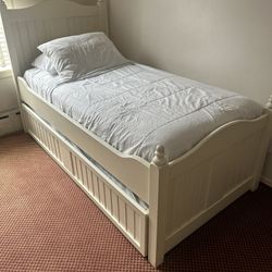 Twin size antique white wood slats bed with trundle  Mattresses included