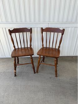 Two wooden chairs.