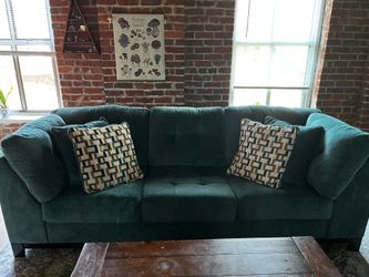 Blue/teal three seater couch