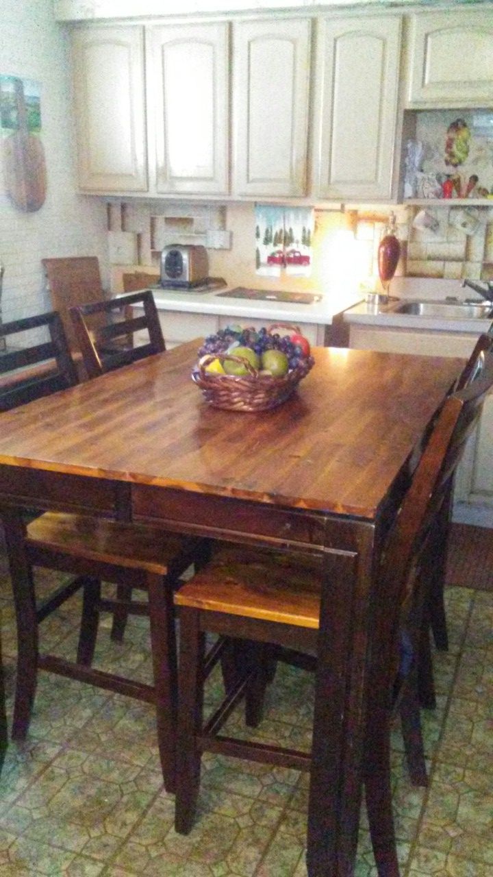 Kitchen table and four chairs. 3feet wide, 54 long and 3 feet high