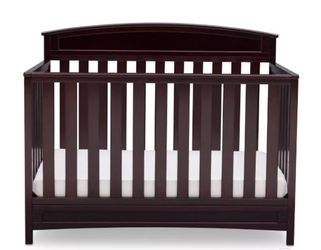 Wooden baby crib with mattress