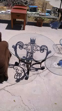 Wrought iron glass top round table