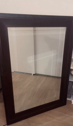 Large dark brown wood mirror