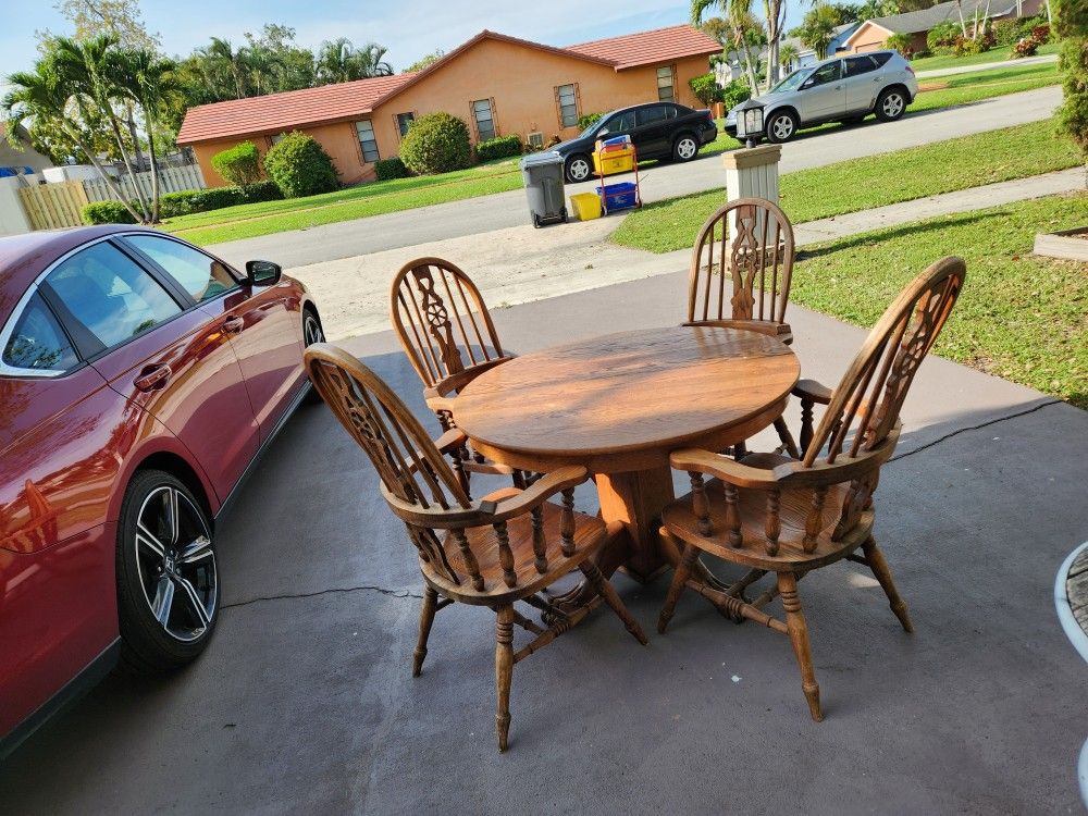 Vintage, solid Wood 42.5" Bear Claw legged table with 4 chairs,