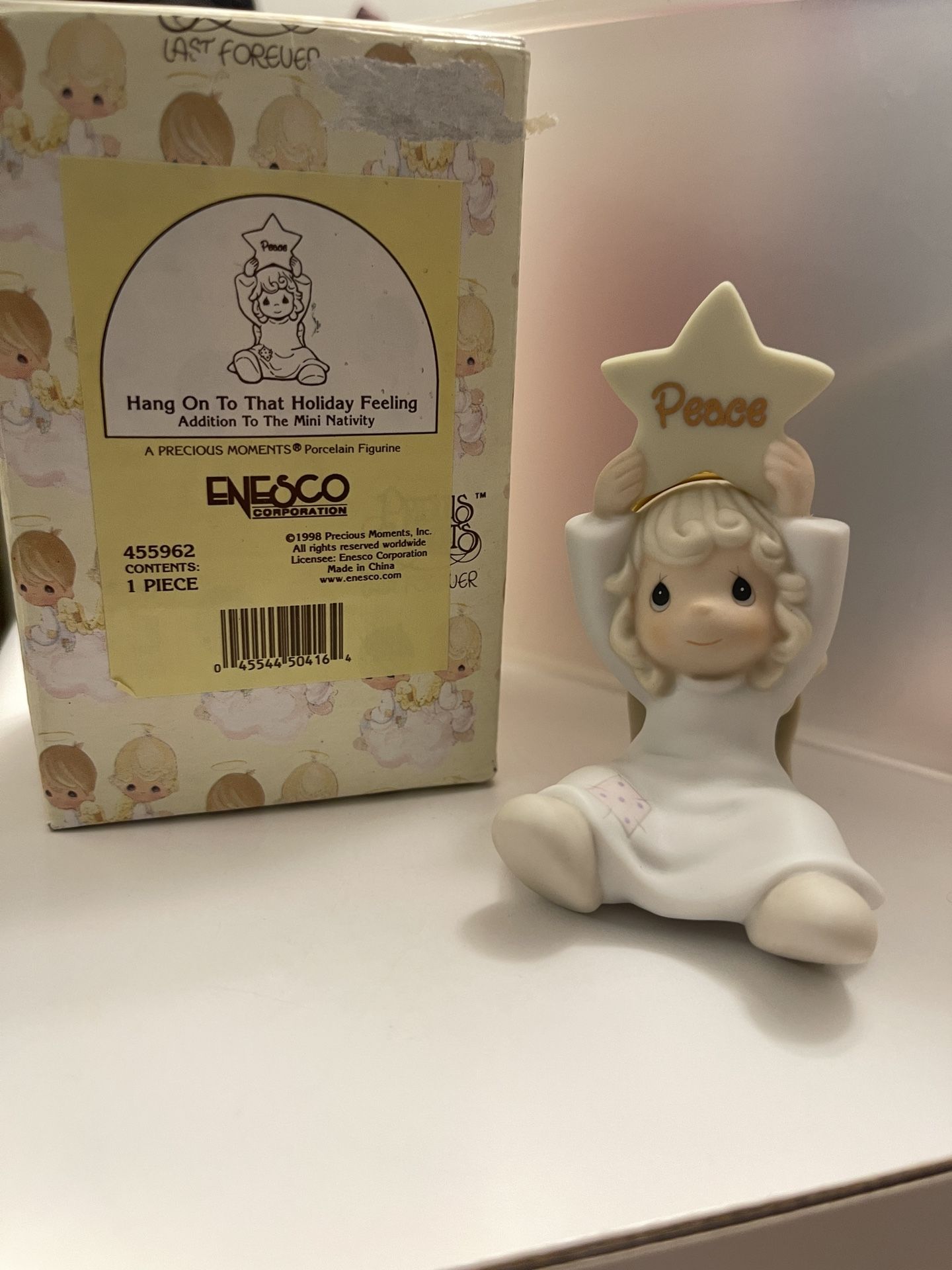 Precious Moments Angel holding peace star 