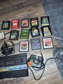 Old school Atari  with games and controller