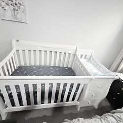 Baby crib with changing station