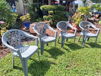 4 Gray plastic chairs