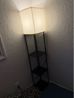 Floor lamp with shelves