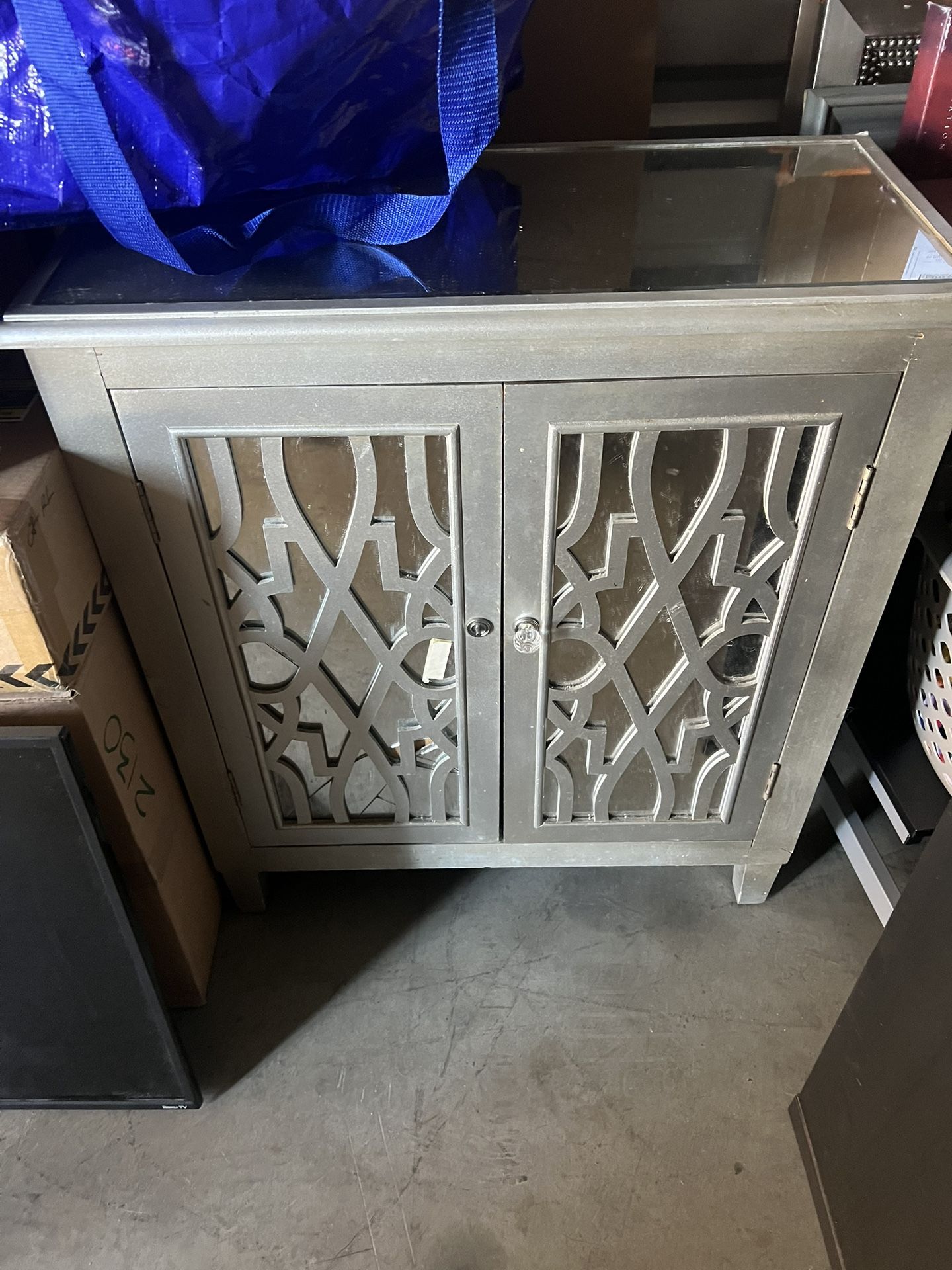 MIRRORED GLASS ACCENT CABINET WITH DECORATIVE DOORS