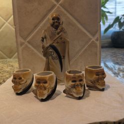 vintage Shofu Japanese ceramic Grim Reaper "Poison" sake decanter set, which typically includes matching skull-shaped shot glasses.