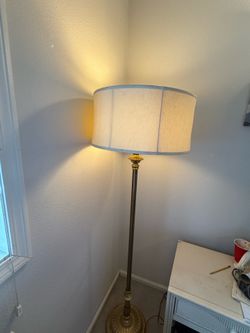 Vintage Brass Floor Lamp with an antique finish and cream fabric shade