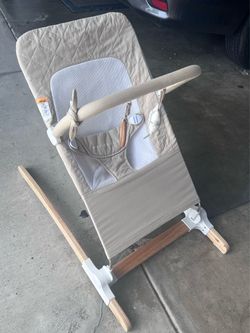 Baby Delight Heirloom Aspen Wooden Baby Bouncer in the Organic Oat colorway.