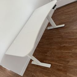 63”x32” electric standing or sitting computer office desk, memory adjustments, holds 220 lbs, white top white frame, no issues at all