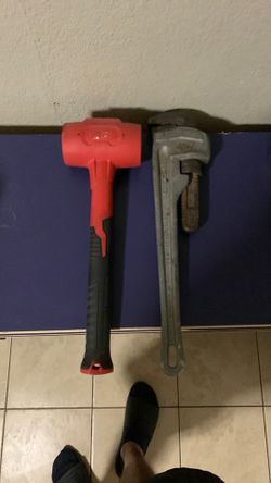 Milwaukee hammer and ridged aluminum pipe wrench