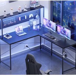 Brand New In The Box- Pamray 60 Inch L Shaped Gaming Desk with LED Lights and Power Outlets Reversible Corner Computer Desk with Pegboard Storage Shel