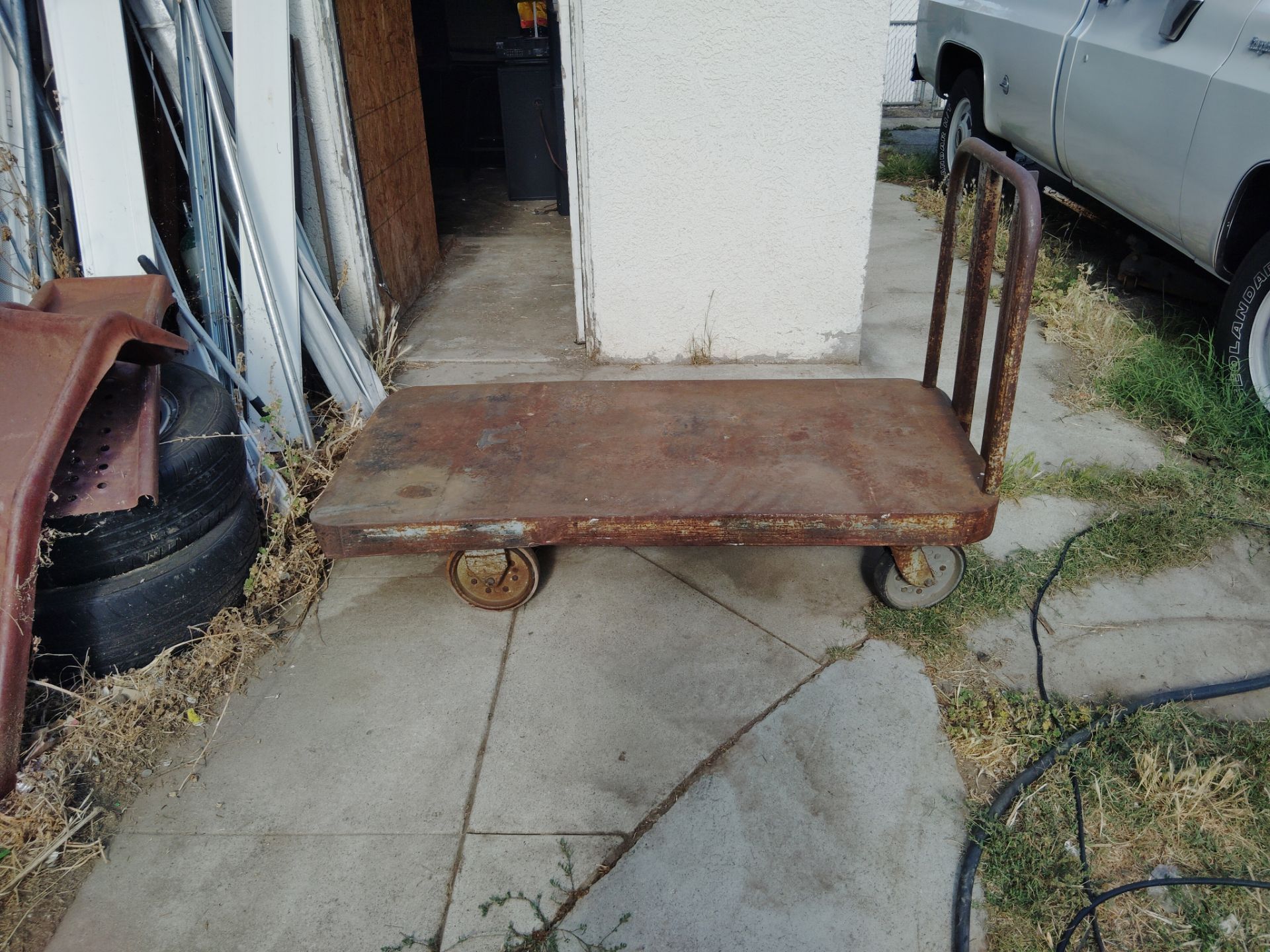 Vintage cart most likely 100 years old or near it makes awesome coffee table or just use it works incredibly smooth fits through all standard sized do
