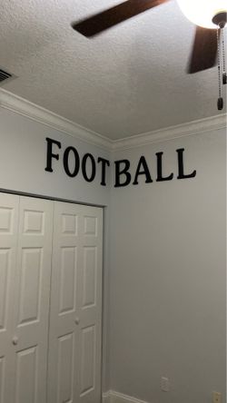 Black wood “football” letters
