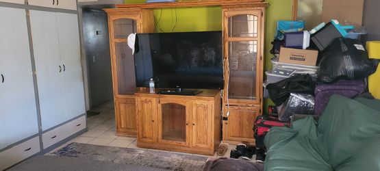 4 piece tall entertainment center and Oak Dining table with centerpiece