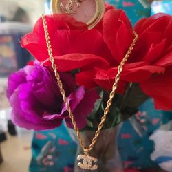 14k  Necklace ,chain Is 22in With 14k Coco Chanel Pendent Cubic Zirconia,  Free Earrings With Purchase ,not real Gold 