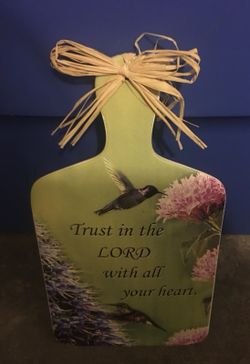 Ceramic maybe ? heavy sign that can hang or stand