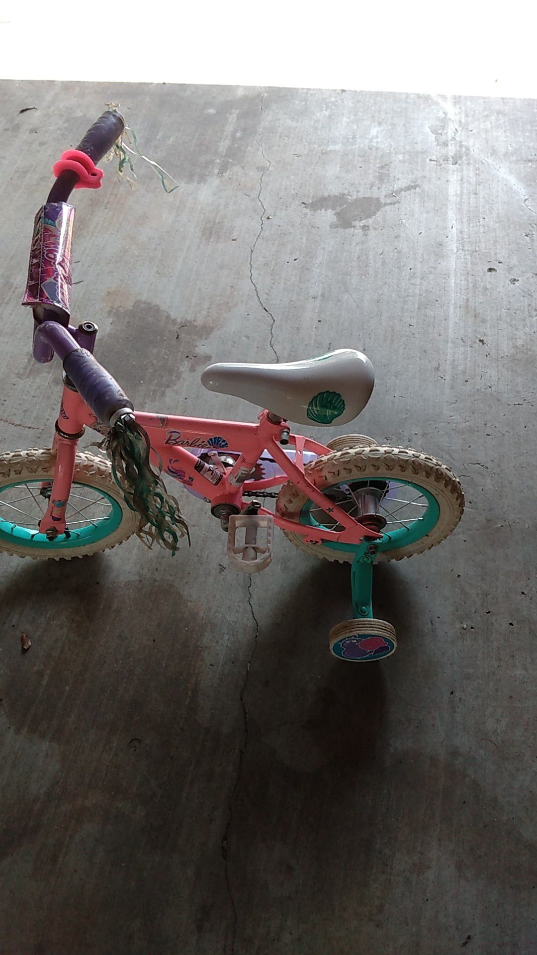 Pink girls bike with training wheels