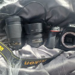 Nikon Camera, 2 Lens,  Battery Charger. Strap.