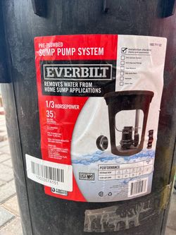 Unused pre-plumbed sump pump system