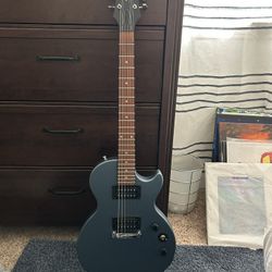 Blue Epiphone Electric Guitar w/ case and amp