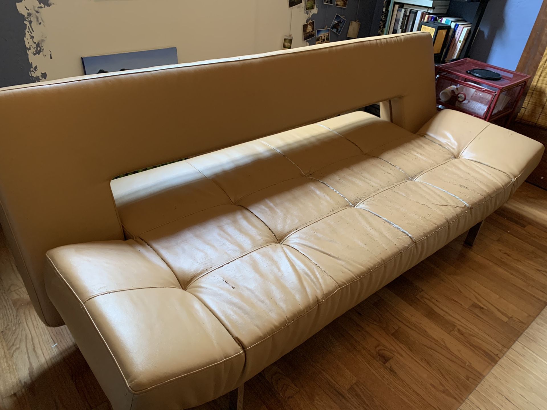 Designer leather futon / couch converts to bed